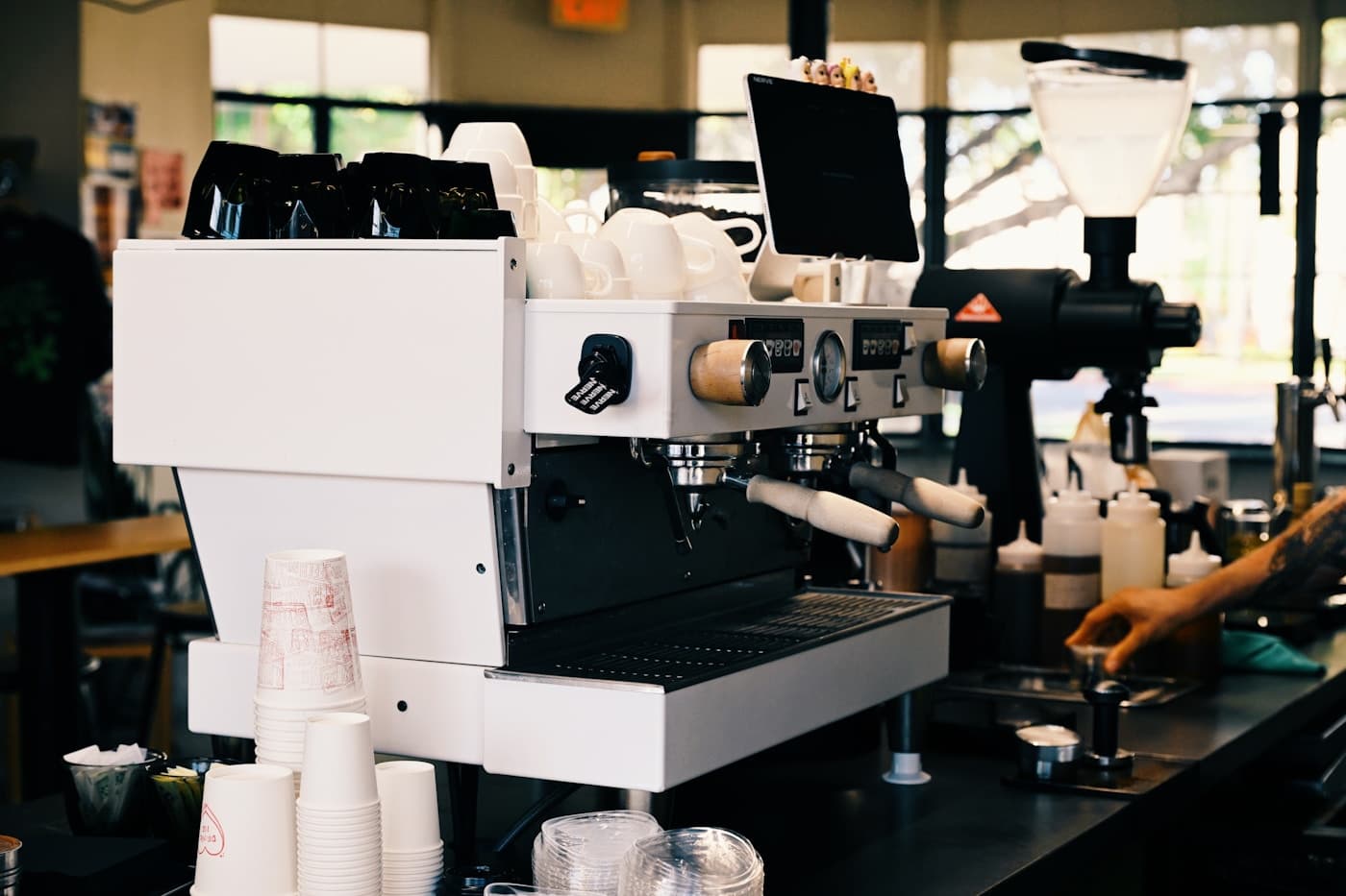 Espresso machine and supplies behind a café counter