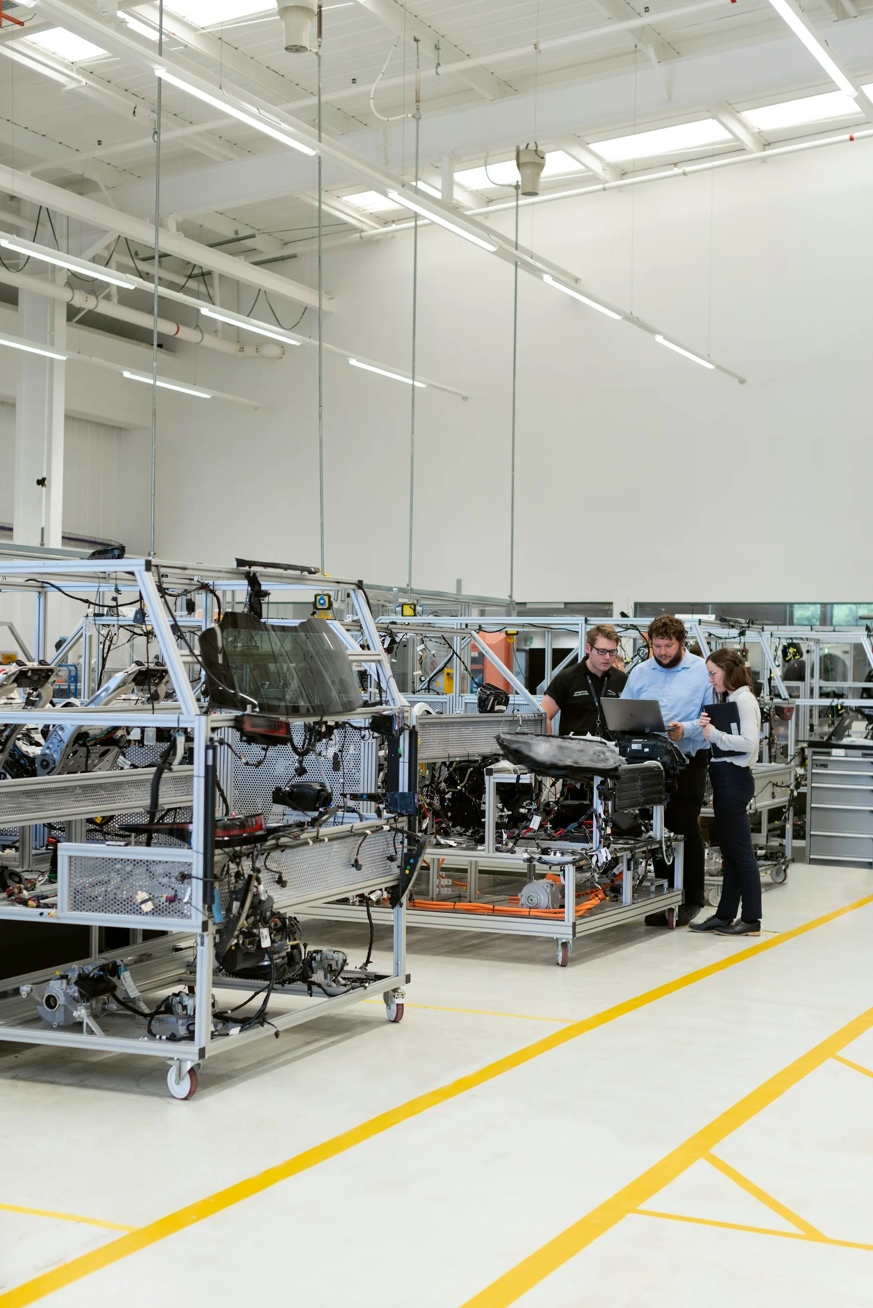 Engineers collaborating in an automotive factory